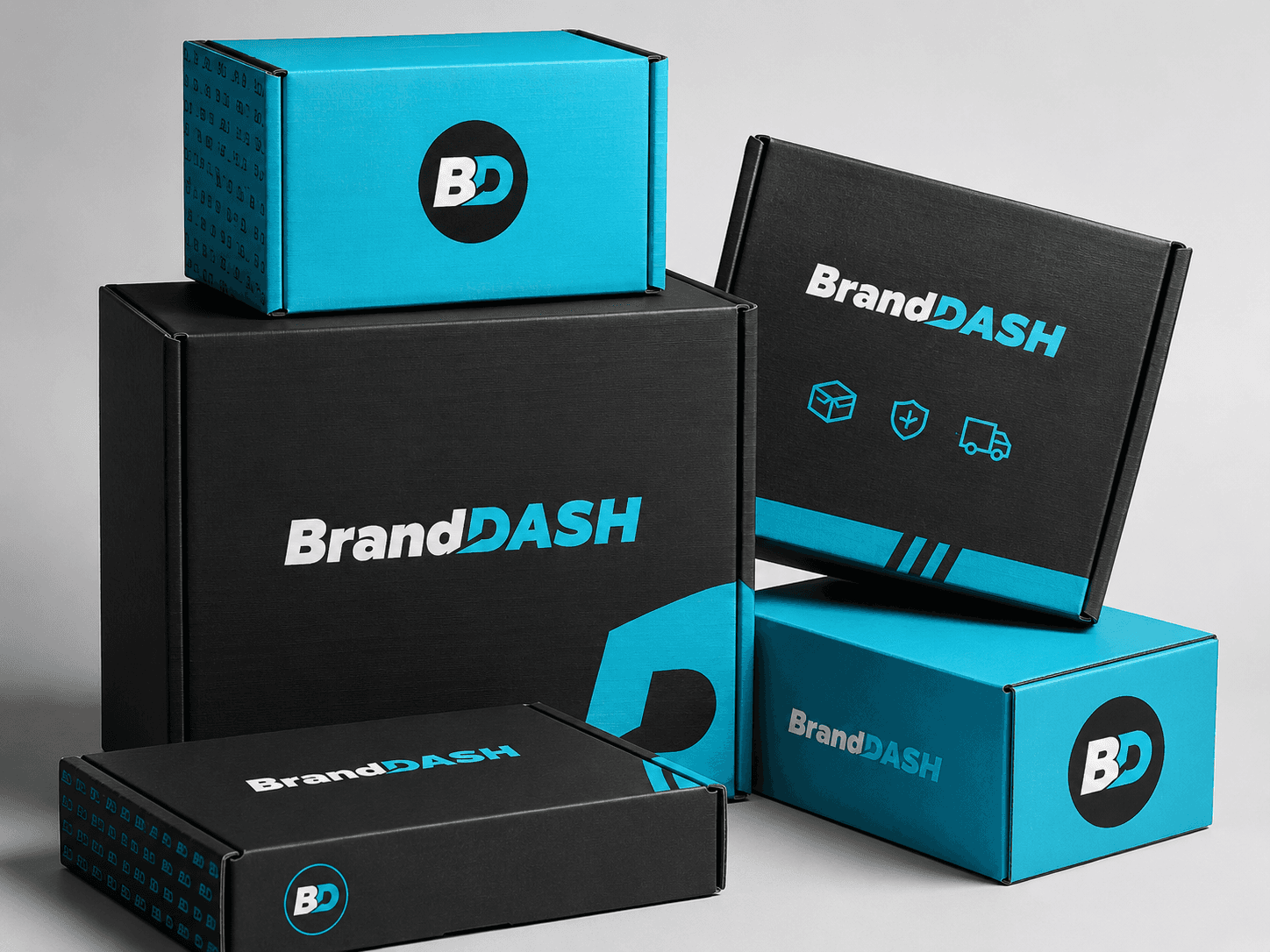 Stacked BrandDash corrugated mailer boxes in black and cyan packaging